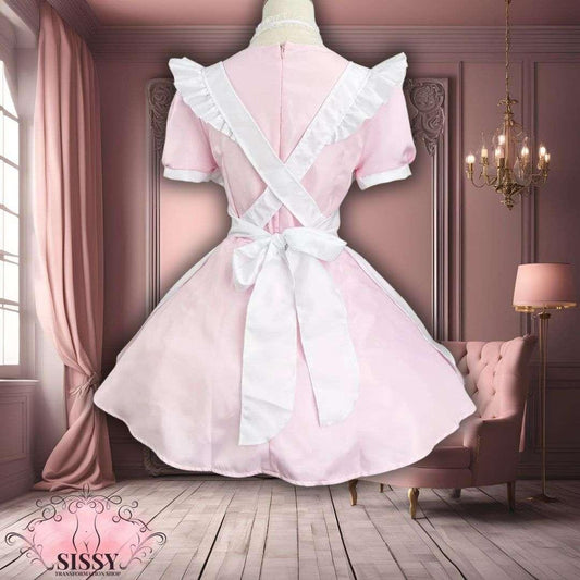 Robe élégante sissy maid rose avec volants et tablier blanc noué dans un intérieur chic