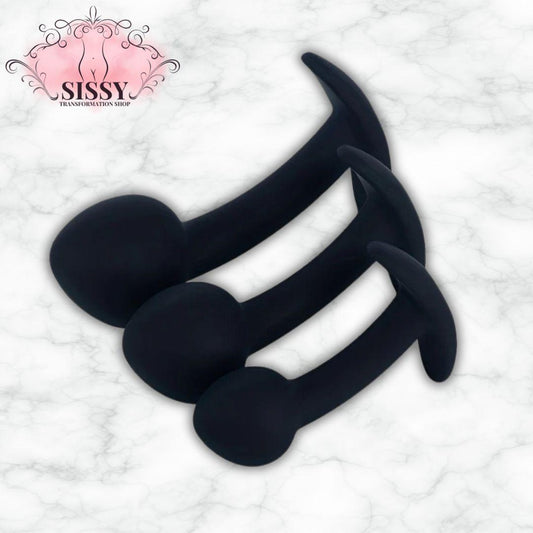 Set de 3 plugs anaux en silicone, tenus à la main