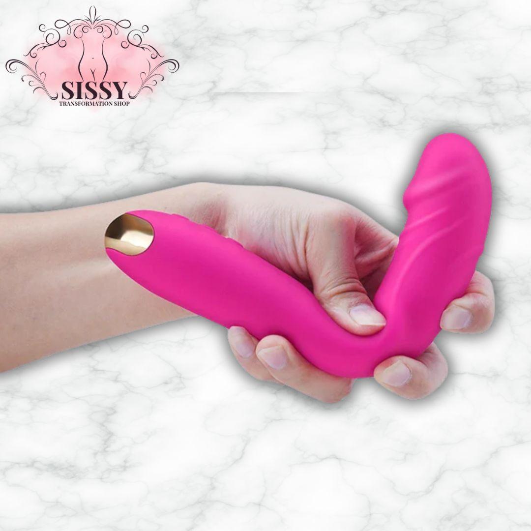 Vibromasseur en silicone rose ergonomique de Sissy Transformation Shop tenu dans une main